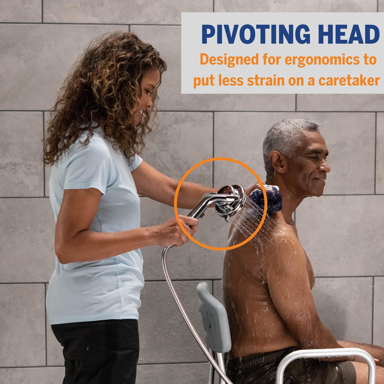 Caretaked helping man taking shower using privoting shower head.